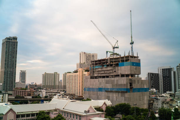 istock Building construction site in downtown city sunset sky 1193124329