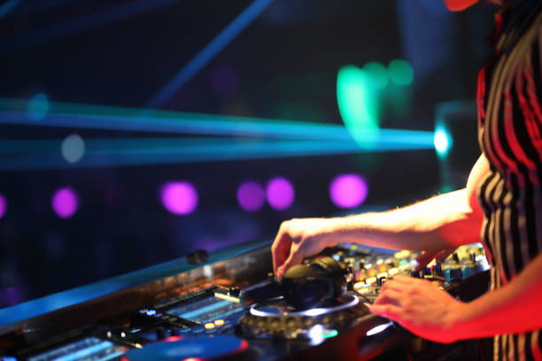 istock Dj mixing in night club 1193124563