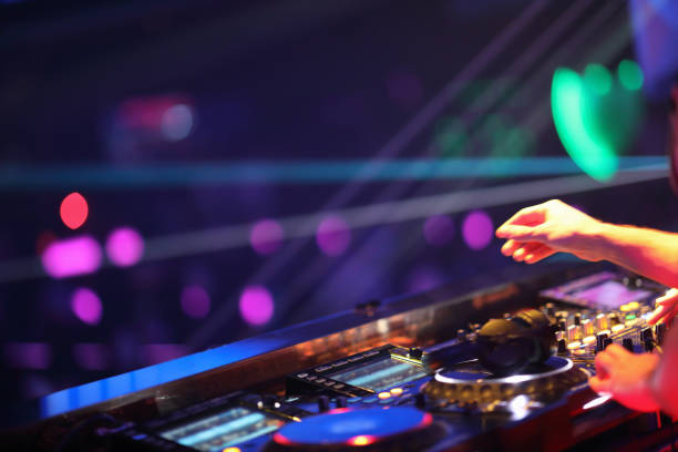istock Dj mixing in night club 1193124637