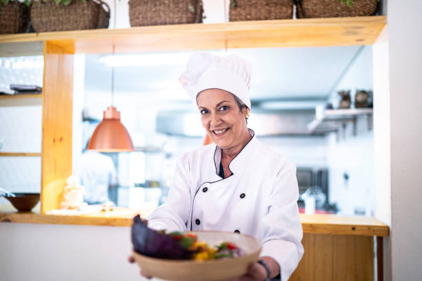 istock Portrait of chef showing his ready dish 1193124703