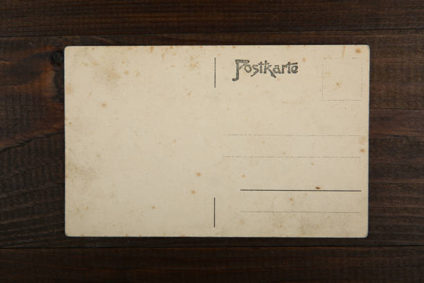 istock vintage post card on wooden background 1193124915
