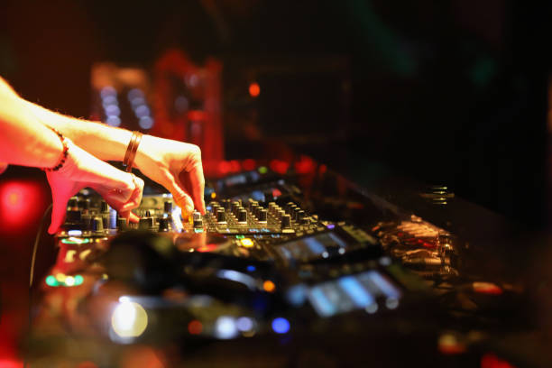 istock Dj mixing in night club 1193125579