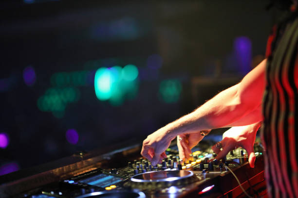 istock Dj mixing in night club 1193125629