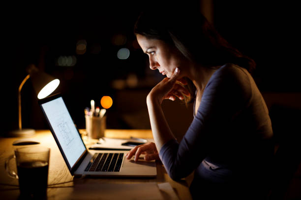 Woman working late at home