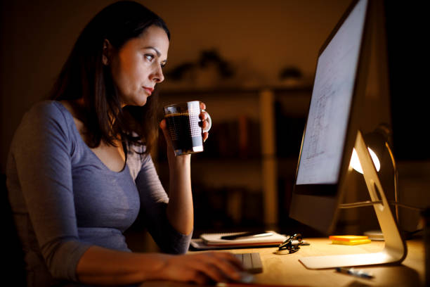 istock Woman working late at home 1193125887