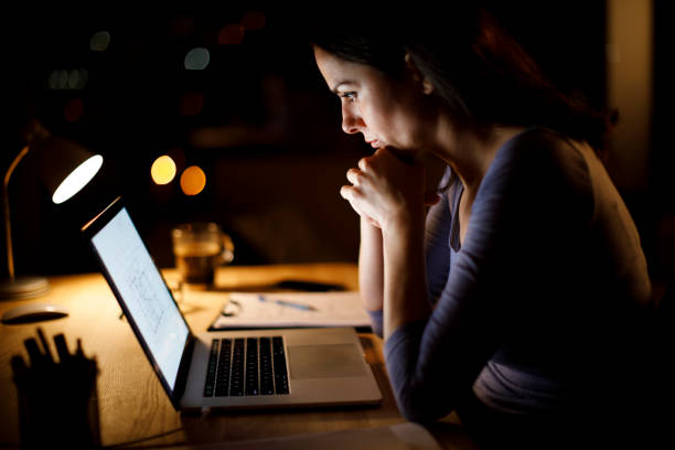 istock Woman working late at home 1193125932