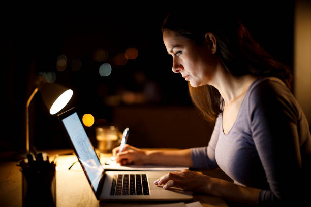 istock Woman working late at home 1193126158