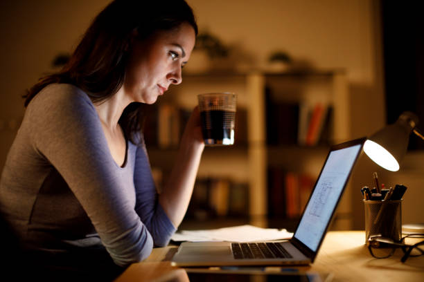 istock Woman working on laptop late at home 1193126253