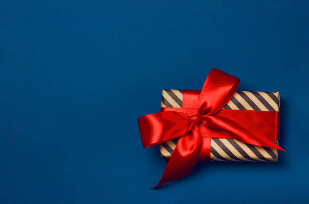 istock Luxuriously wrapped gift with lush ribbon 1193127283