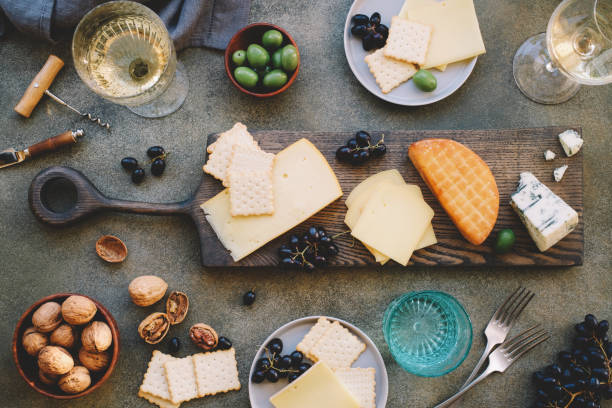 istock Flat lay of cheese platter with cheese assortment, grapes and nuts 1193127992
