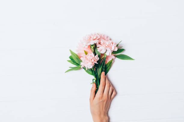 istock Woman's hand holding beautiful bouquet 1193128837