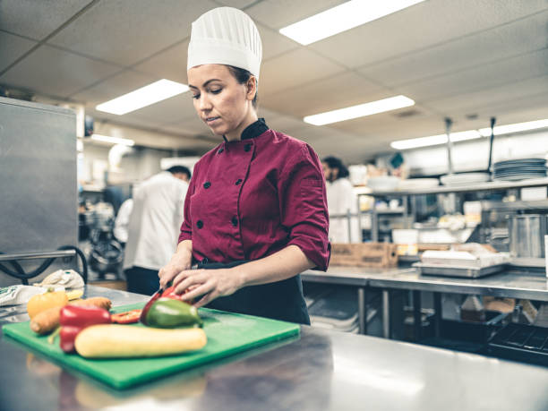 istock Female Chef working in industrial kitchen 1193131474
