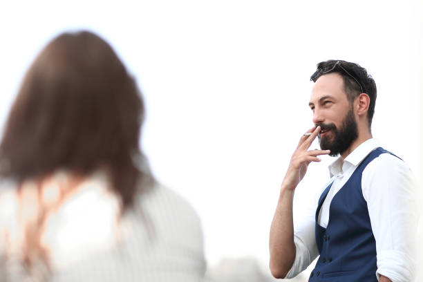 close up.businessman Smoking while standing near an office window