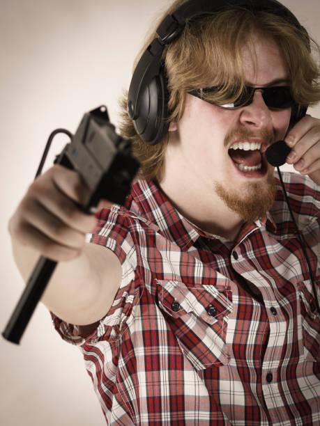 istock Gamer man shooting from gun 1193133012