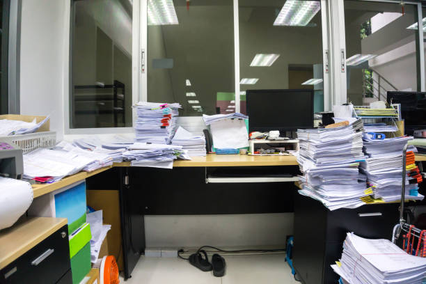 istock Busy, messy and cluttered workplace, full of documents 1193133211