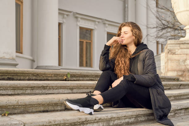istock Brooding girl holding chin looks at blank space 1193133907