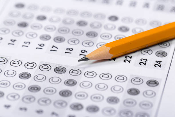 istock testing in exercise and exam paper. computer sheet with pencil in school test room, education concept 1193138372