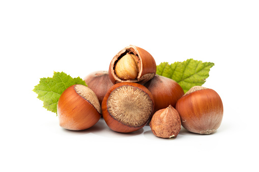Hazelnuts with leaves isolated on a white background