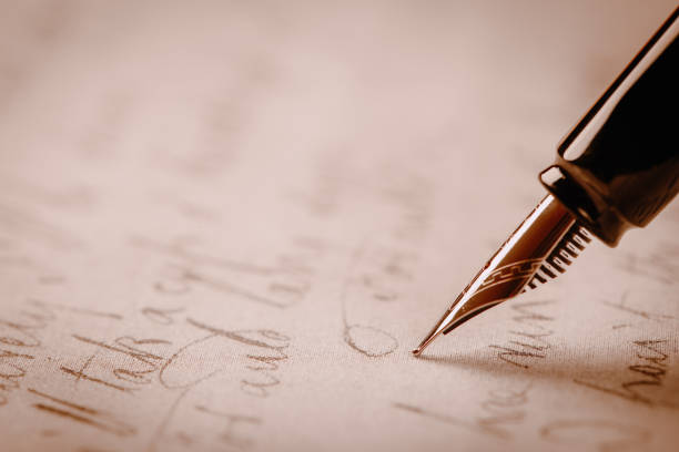istock fountain pen on paper with ink text closeup 1193138802
