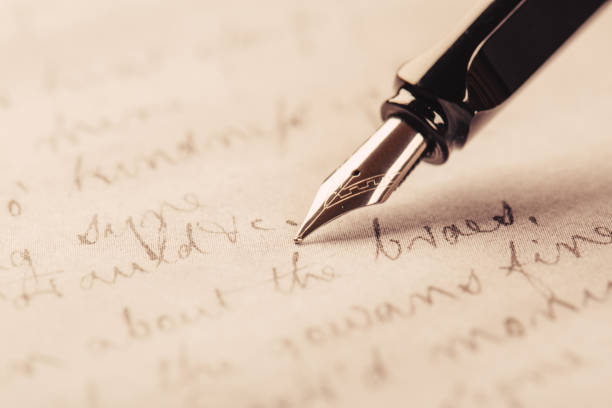 istock fountain pen on paper with ink text closeup 1193139697