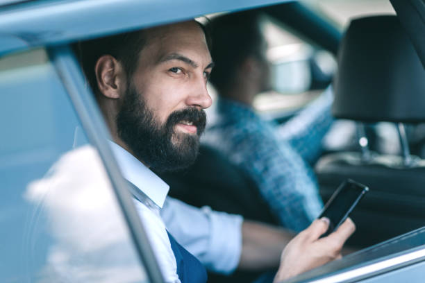 istock close up.businessman reading SMS on his smartphone 1193139710