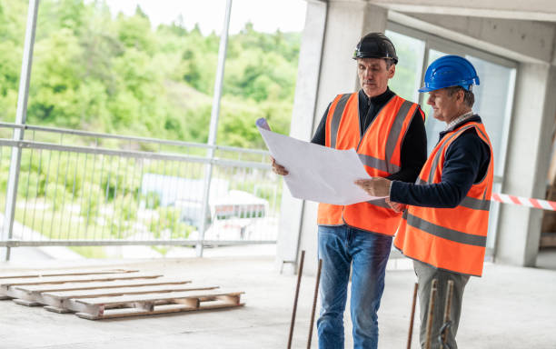 istock Investor Expressing His Wishes To Construction Foreman At A Construction Site 1193140700