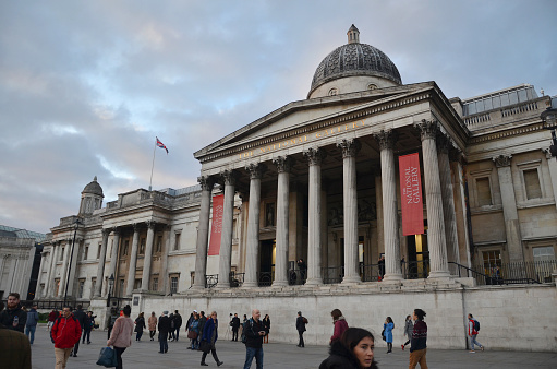 London, UK - April 4, 2023: People walking through the main entrance of  British Museum.