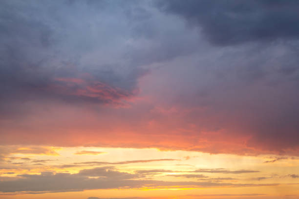 istock Sunset sky covered with orange puffy clouds in the evening. 1193141583