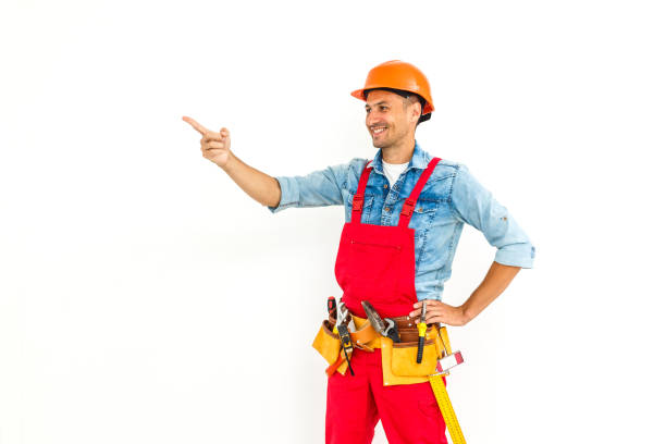 istock Serious Male Construction Worker with short black hair in uniform with arms folded - Isolated 1193144721