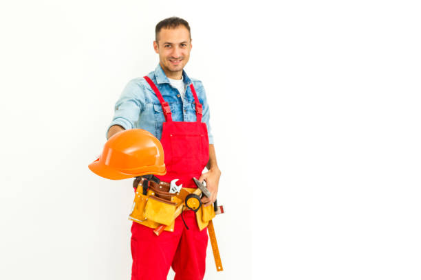 istock Serious Male Construction Worker with short black hair in uniform with arms folded - Isolated 1193144767