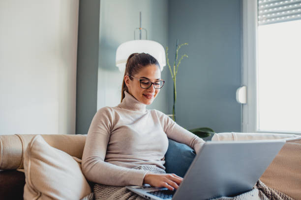 istock A young woman using laptop indoors 1193145157