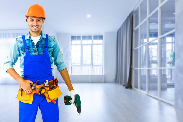 istock handyman with his helmet in warehouse 1193145251