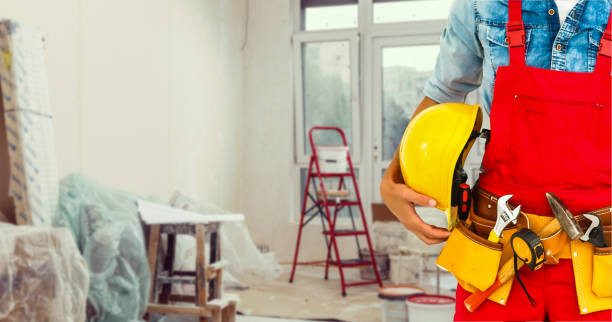 istock handyman with his helmet in warehouse 1193145316