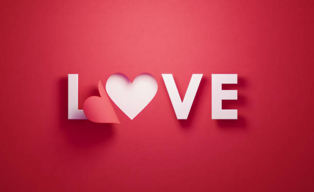 istock Heart Shape and Love Text on Red Background 1193145331