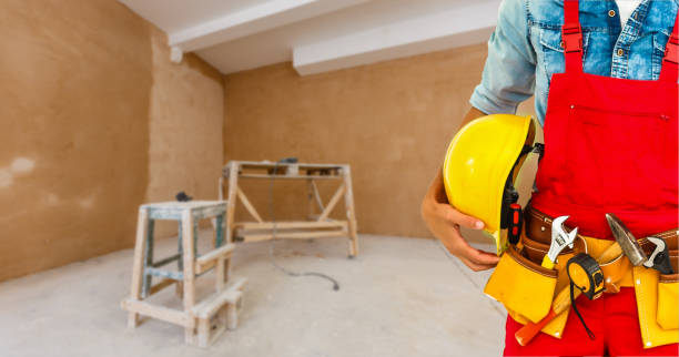 istock handyman with his helmet in warehouse 1193145397