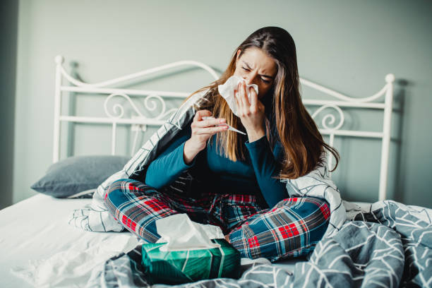 istock Young woman in bed having a cold 1193145491