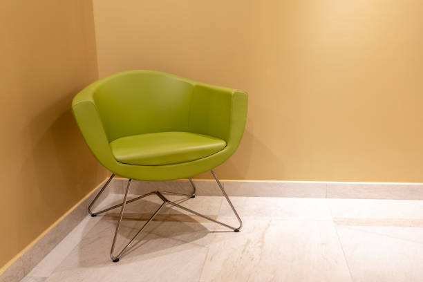 modern white chair on green background