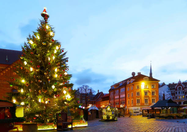 istock Glowing Christmas tree at Dome square in old Riga reflex 1193149196