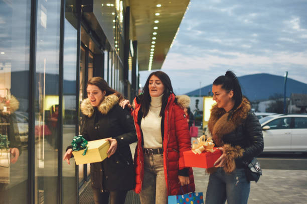 istock Girls in christmas shopping 1193149355