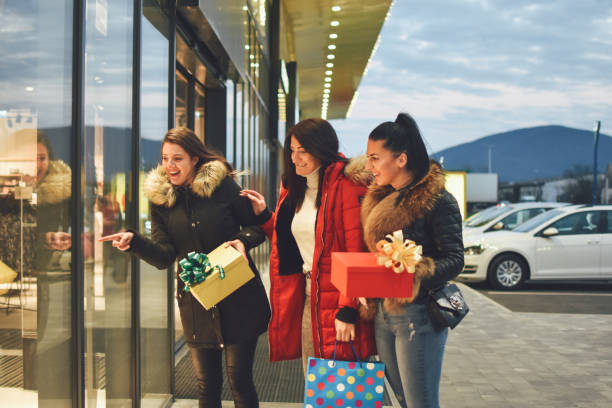 istock Girls in christmas shopping 1193149401