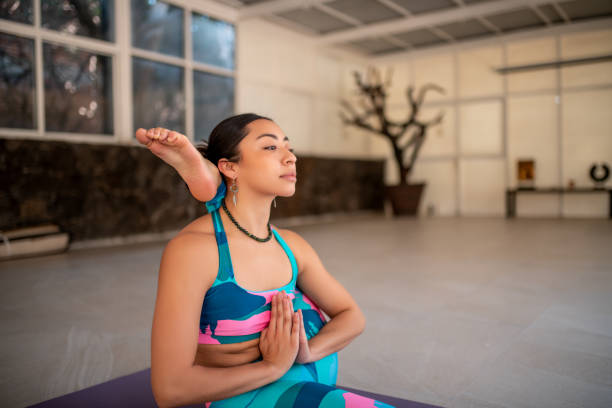 Woman doing The Eka Pada Sirasana