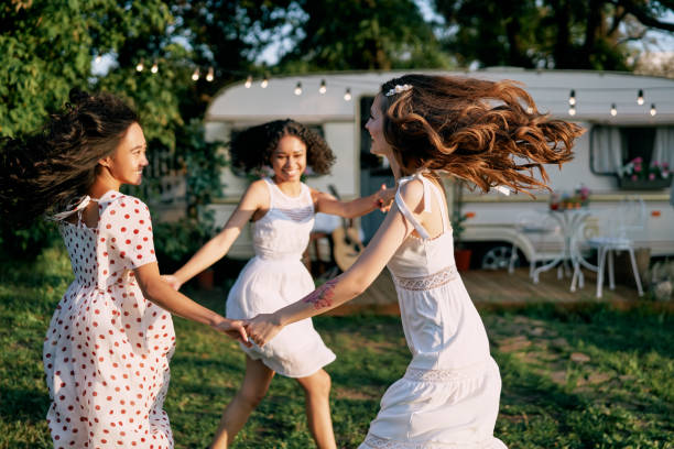istock Happy beautiful women dancing in circle during a picnic 1193154145