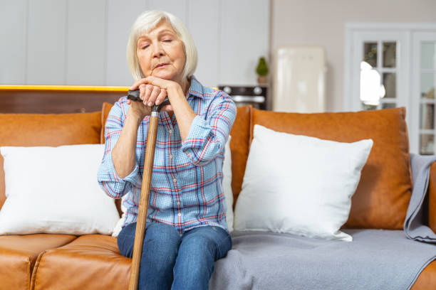 istock Senior lady sleeping with a walking stick 1193156202