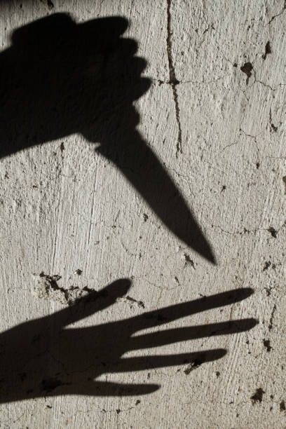 istock Shadows. Criminal and victim. 1193156892