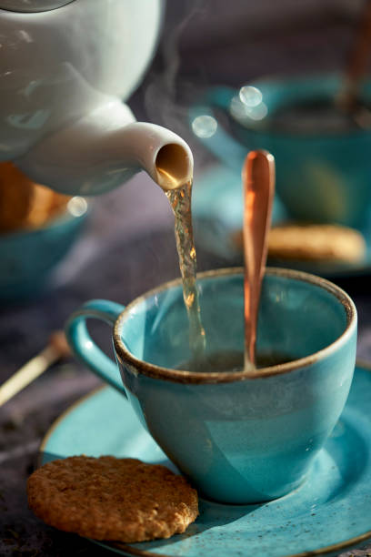 istock Cup of Black Tea Served with Biscuits 1193156943