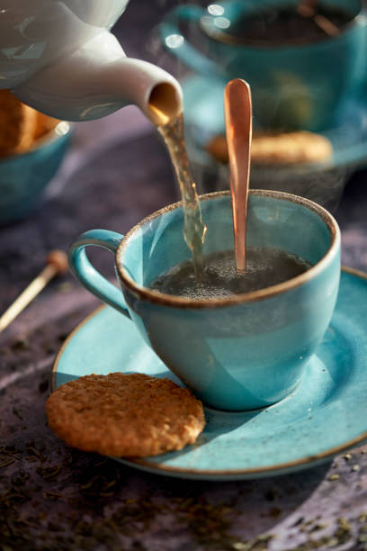 istock Cup of Black Tea Served with Biscuits 1193156953