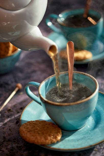 istock Cup of Black Tea Served with Biscuits 1193156960