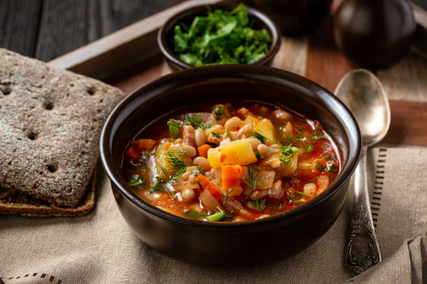 istock White bean soup with bacon, on wooden tray. 1193158803
