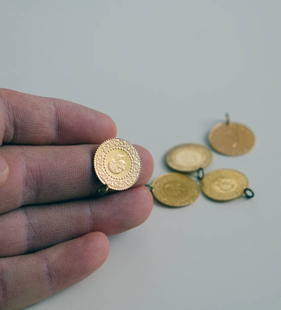 istock Turkish quarter endless gold on a white ground, gold coins, 1193160185