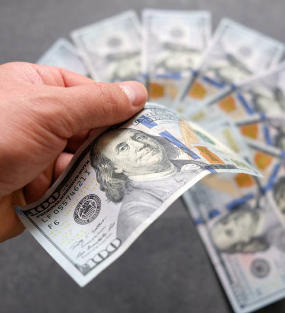 istock a large amount of 100 usd banknotes on a backdrop, 1193160341